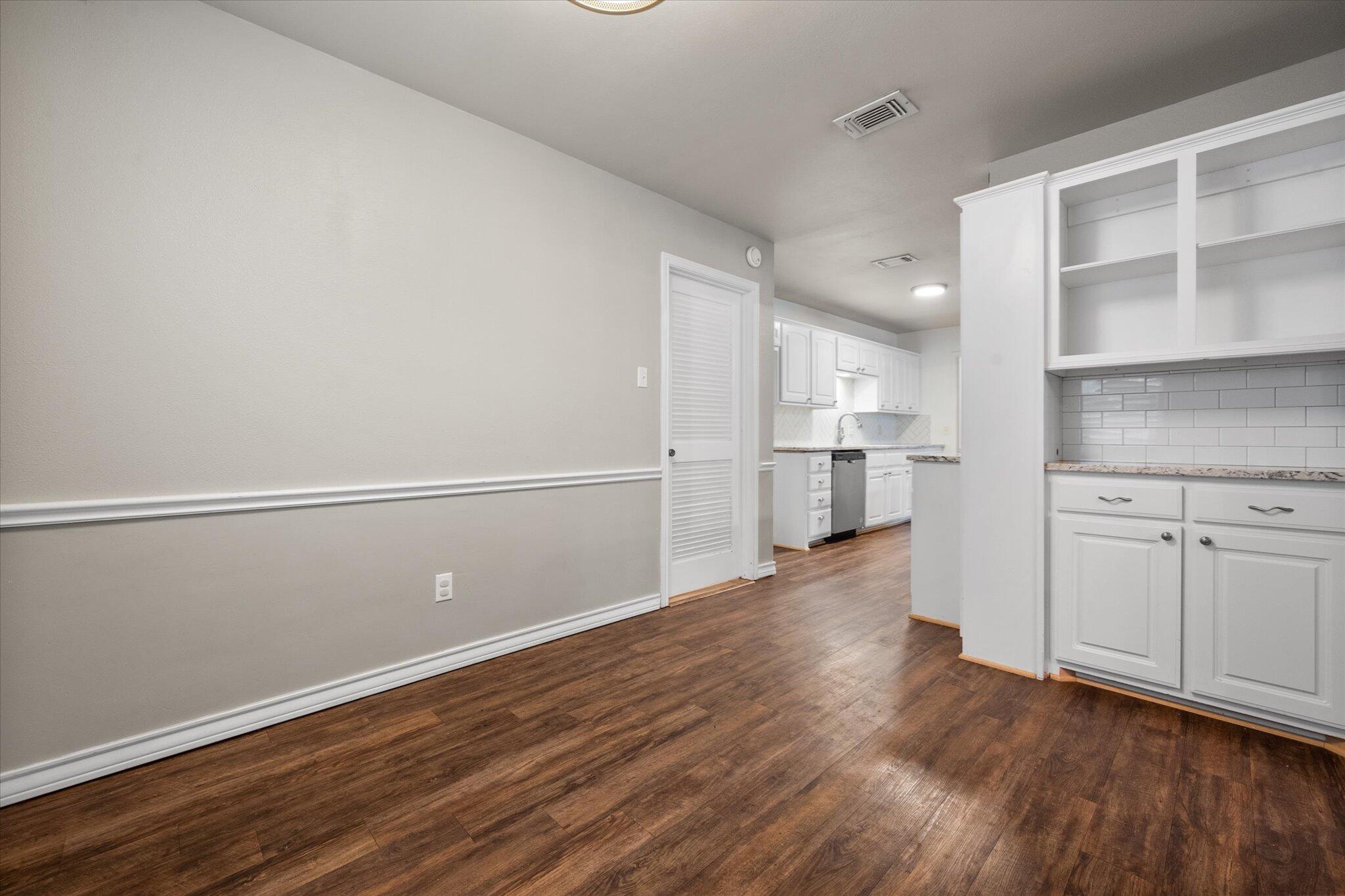 5309 77th Street Lubbock, TX 79424 - Photo 22 of 37 a view of a kitchen with wooden floor and a kitchen