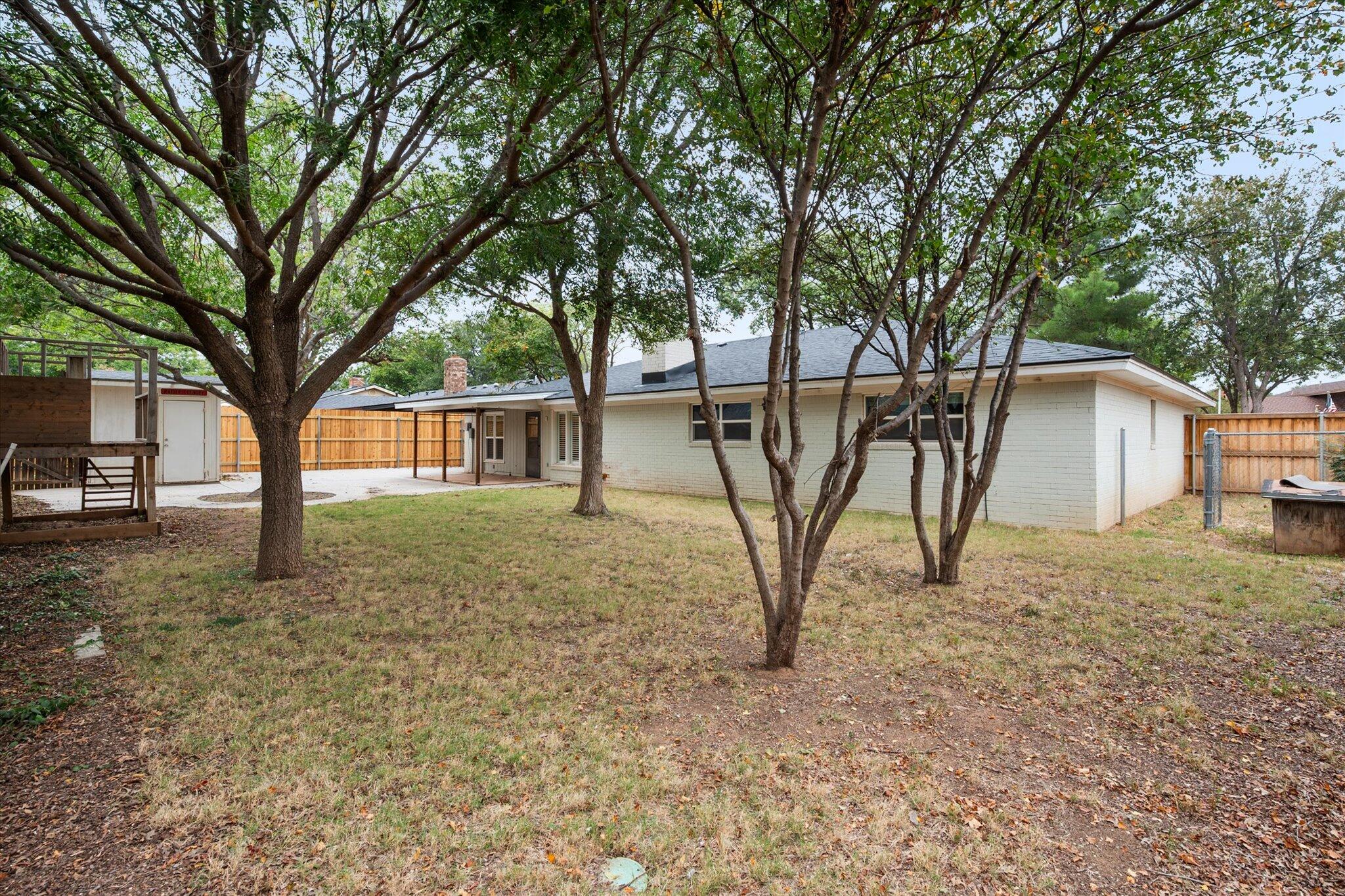 5309 77th Street Lubbock, TX 79424 - Photo 37 of 37 a view of a house with a backyard