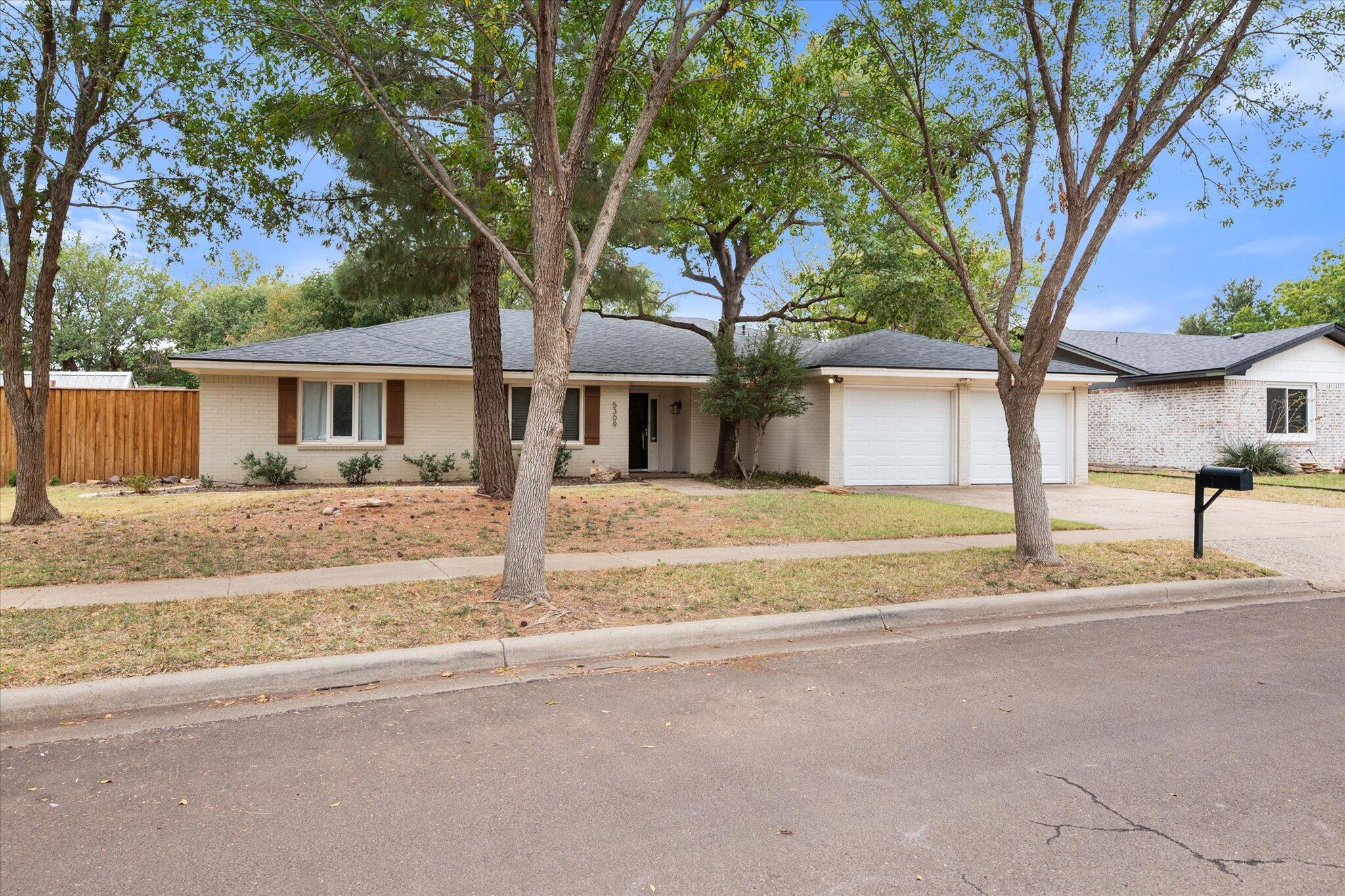 5309 77th Street Lubbock, TX 79424 - Photo 4 of 37 front view of a house with a small yard