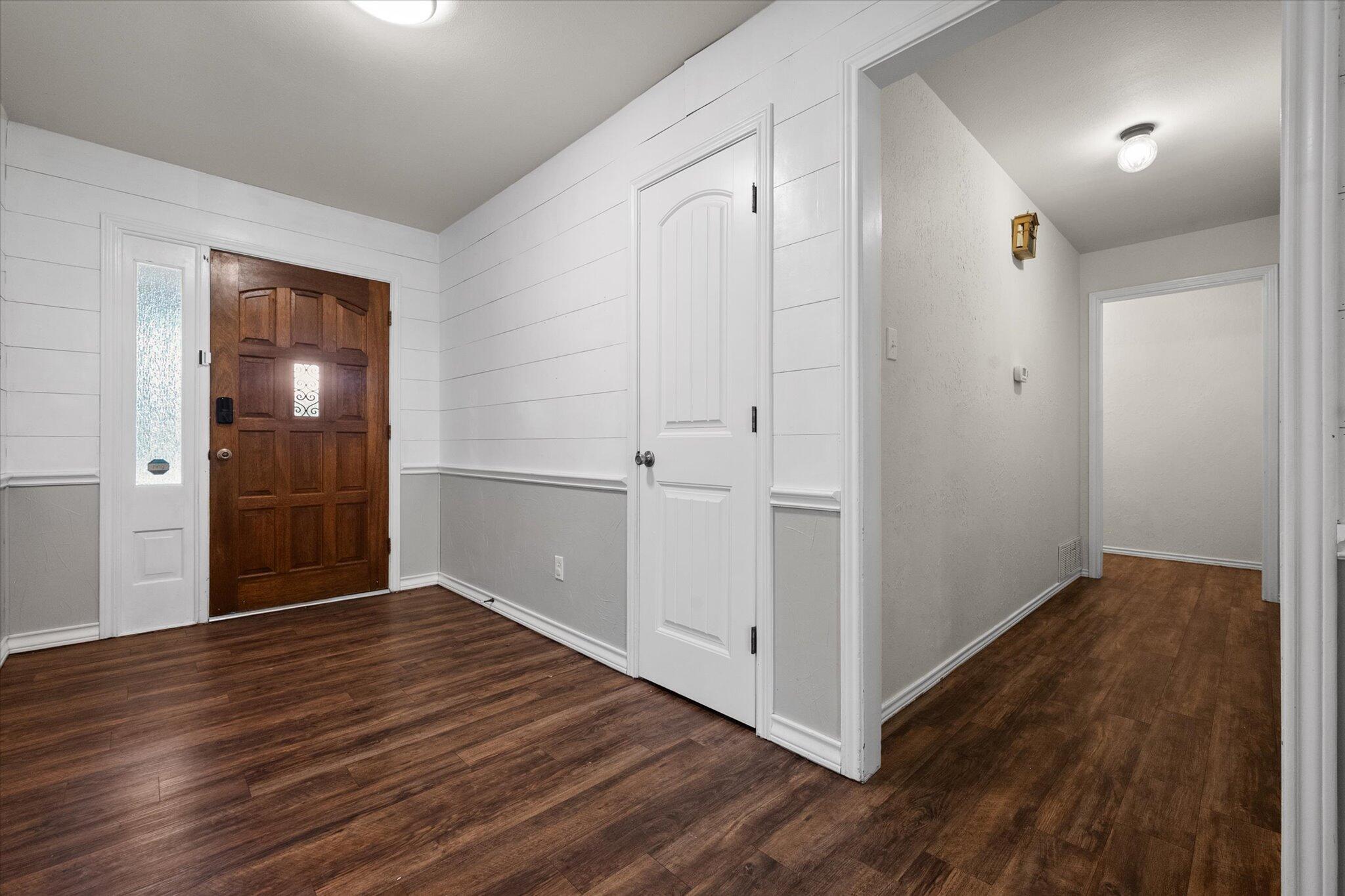 5309 77th Street Lubbock, TX 79424 - Photo 8 of 37 a view of an empty room with wooden floor