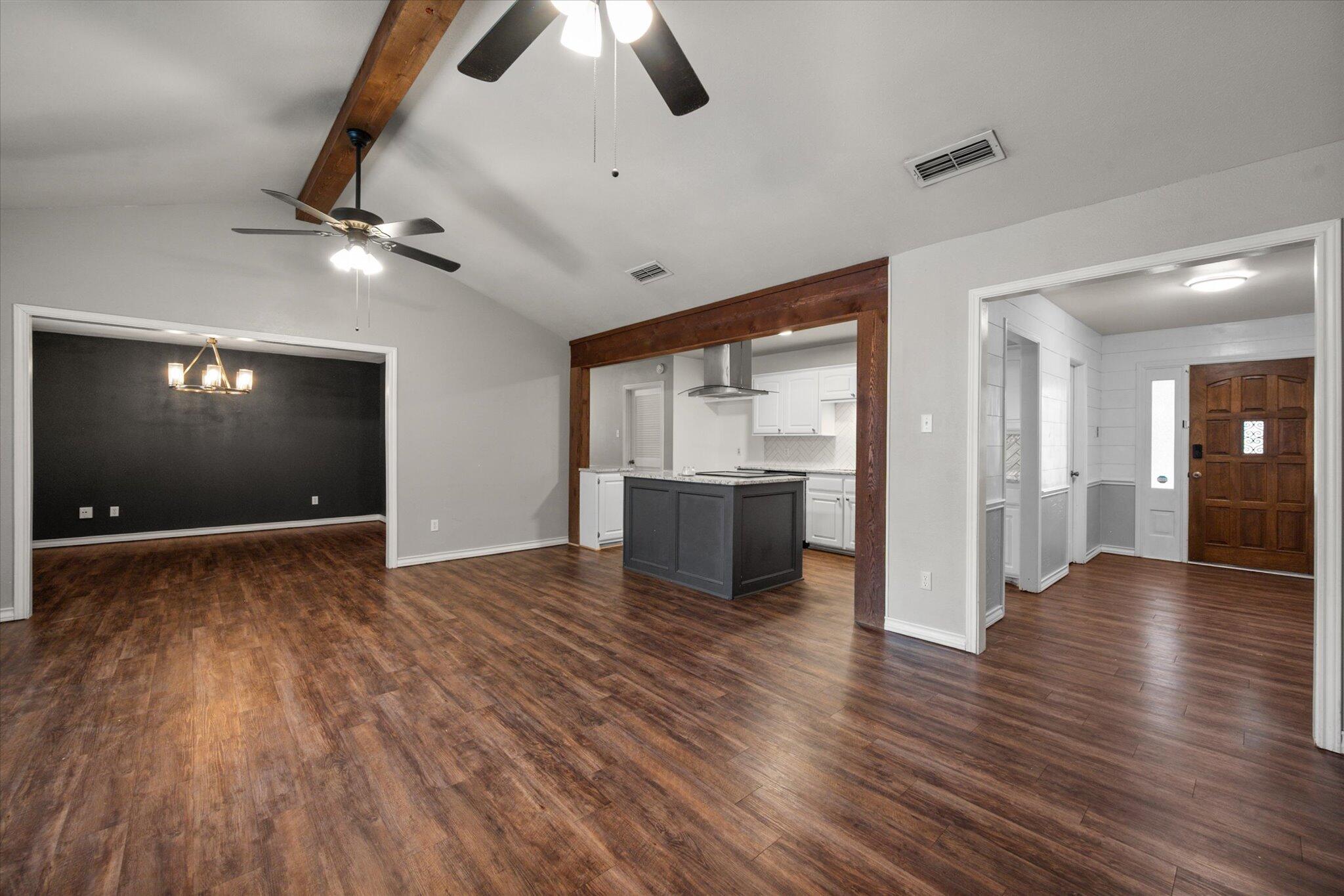 5309 77th Street Lubbock, TX 79424 - Photo 10 of 37 a view of an empty room with window and wooden floor