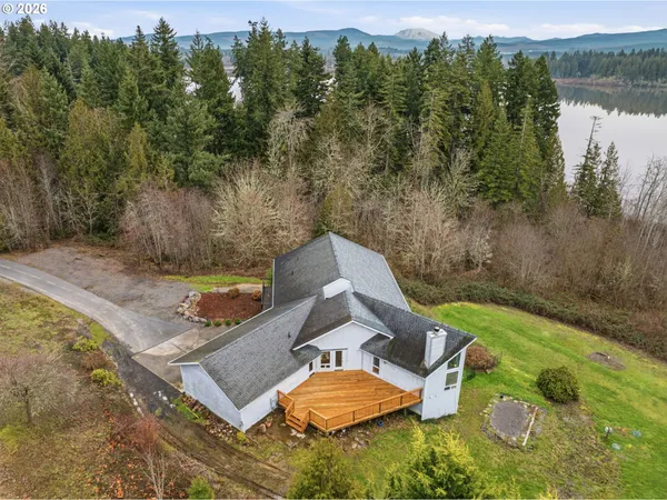 an aerial view of a house with outdoor space