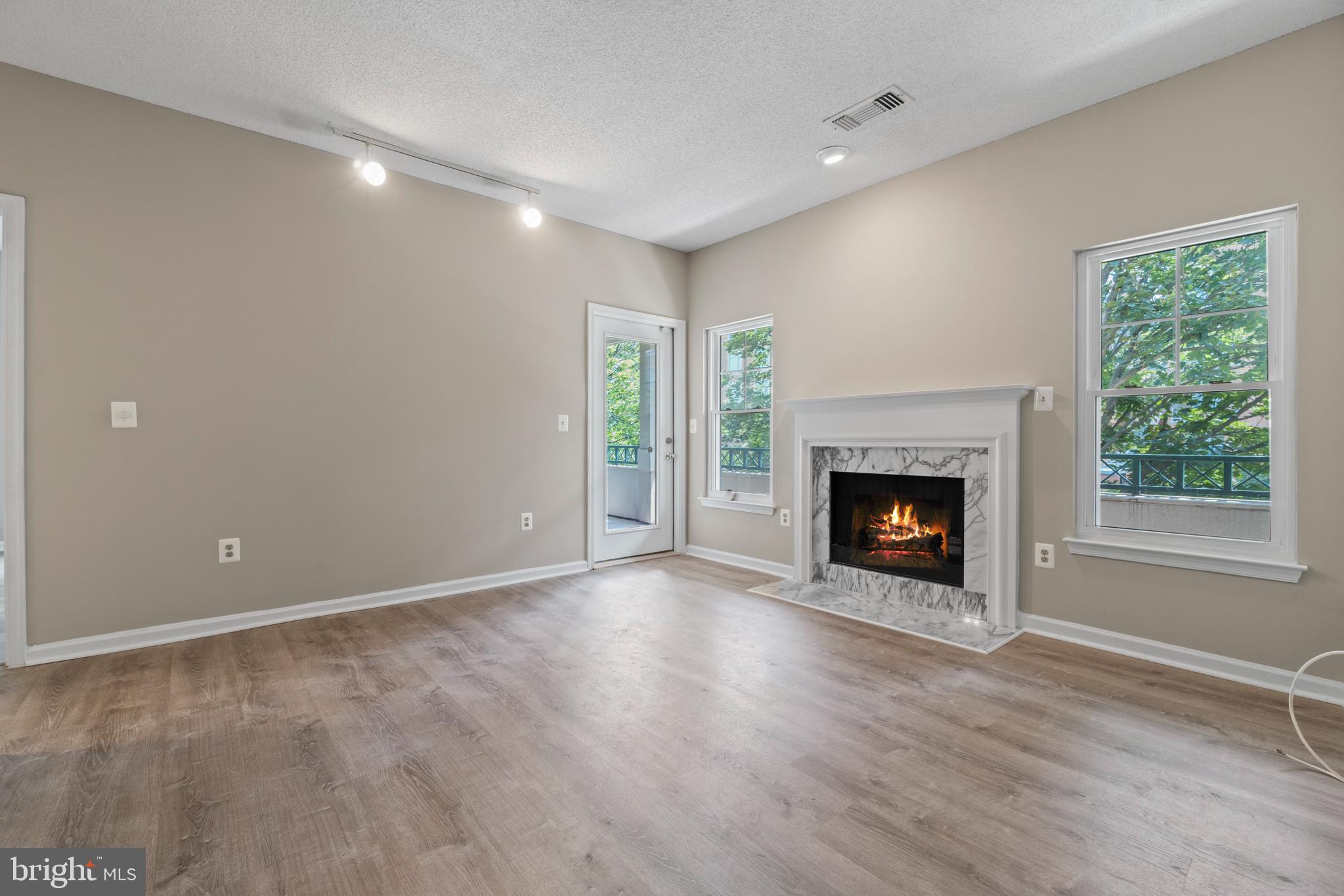 12005 Taliesin Place, Unit 23 Reston, VA 20190 - Photo 12 of 32 Spacious family room with fireplace