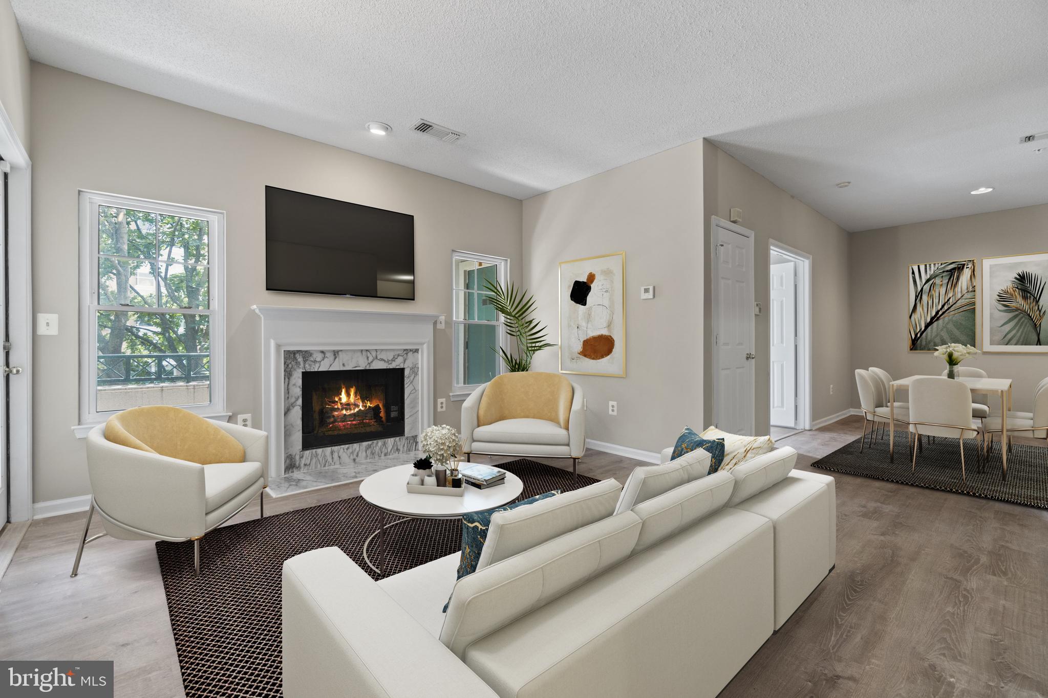12005 Taliesin Place, Unit 23 Reston, VA 20190 - Photo 13 of 32 Family room with fireplace (Virtually staged)