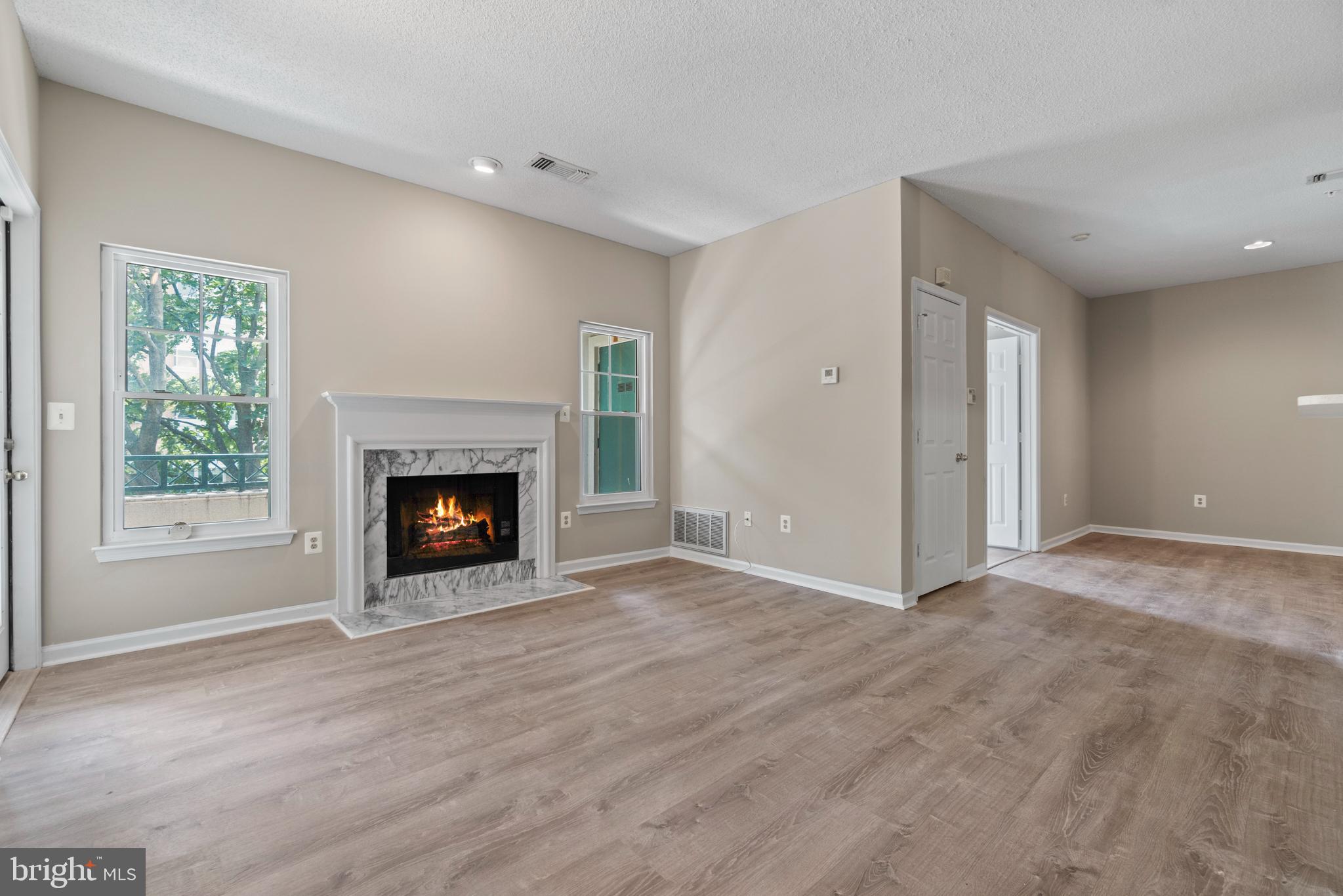 12005 Taliesin Place, Unit 23 Reston, VA 20190 - Photo 14 of 32 Spacious family room with fireplace