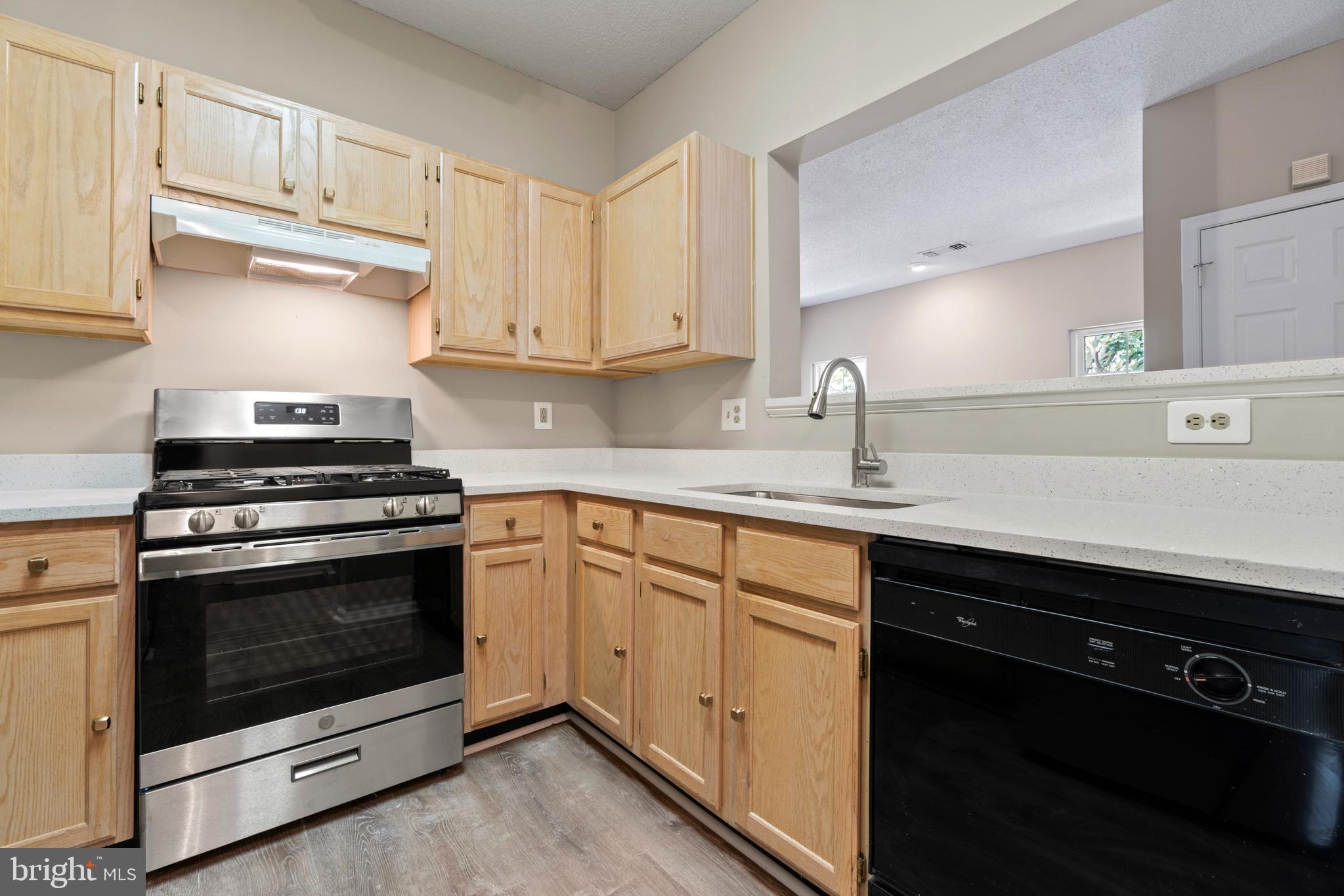 12005 Taliesin Place, Unit 23 Reston, VA 20190 - Photo 9 of 32 Kitchen opens to spacious family room