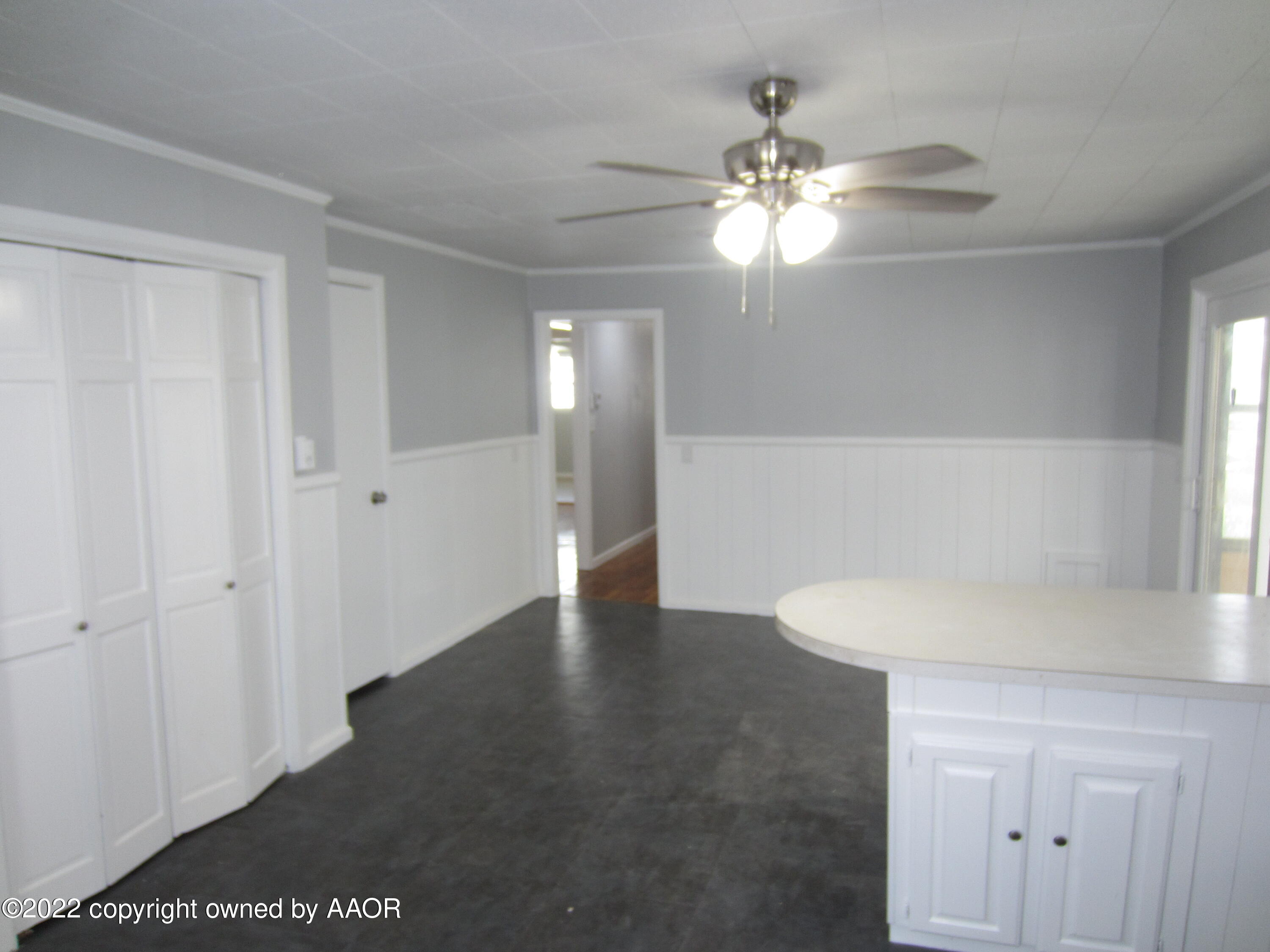 2002 North Mirror Street Amarillo, TX 79107 - Photo 4 of 13 a view of an empty room with a chandelier fan