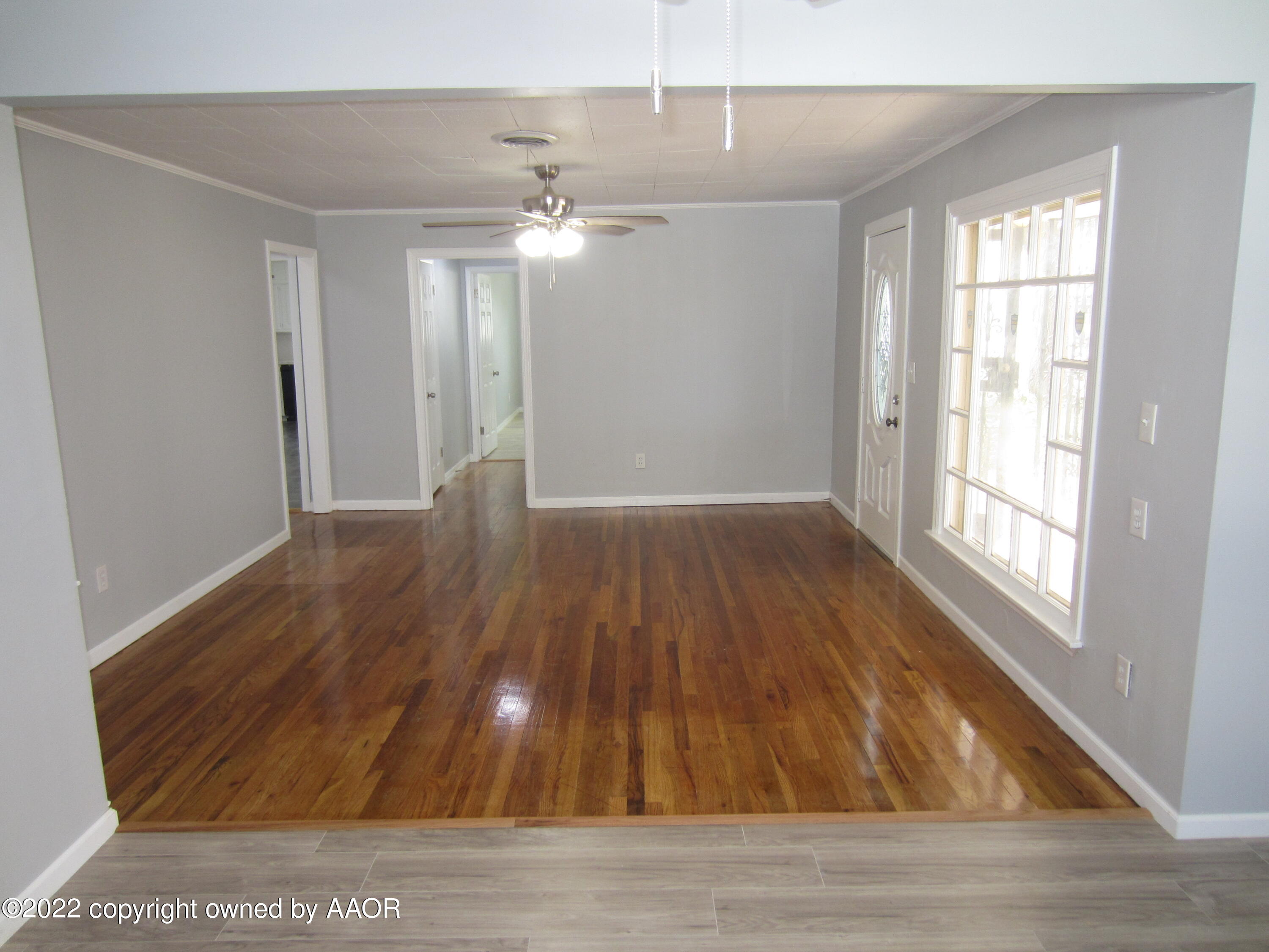 2002 North Mirror Street Amarillo, TX 79107 - Photo 6 of 13 wooden floor in an empty room with a window
