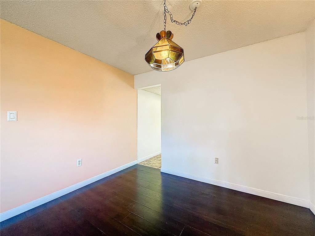 500 Newell Hill Road, Unit 108A Leesburg, FL 34748 - Photo 20 of 44 a view of a room with wooden floor
