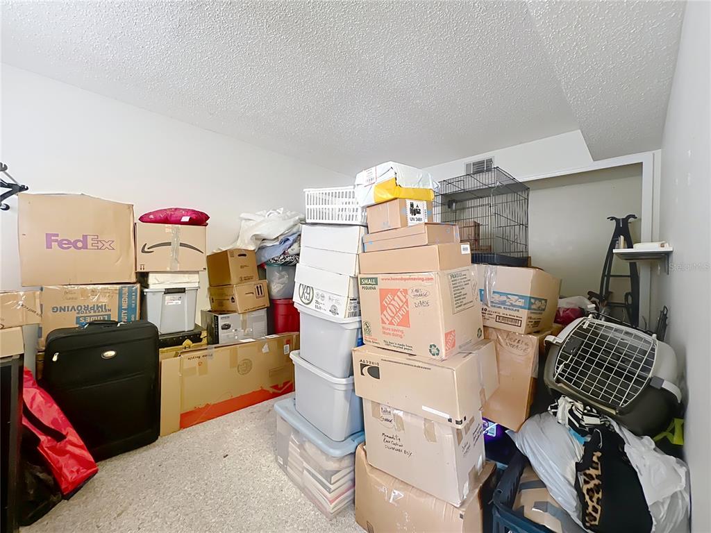500 Newell Hill Road, Unit 108A Leesburg, FL 34748 - Photo 22 of 26 a storage room with washer and dryer