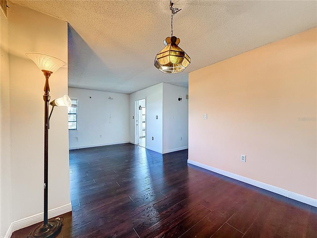 500 Newell Hill Road, Unit 108A Leesburg, FL 34748 - Photo 22 of 44 a view of a storage & utility room with wooden floor