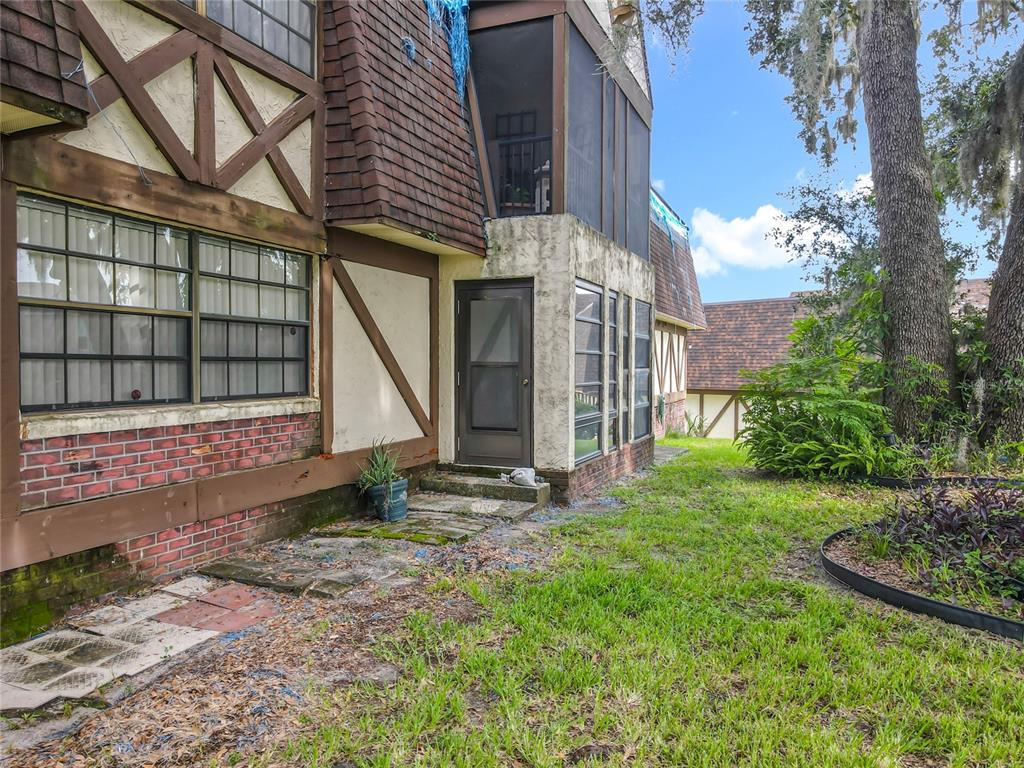 500 Newell Hill Road, Unit 108A Leesburg, FL 34748 - Photo 24 of 26 a view of a house with backyard and garden