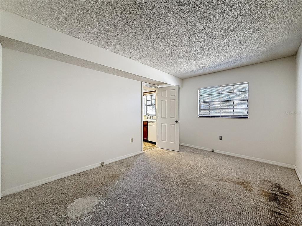 500 Newell Hill Road, Unit 108A Leesburg, FL 34748 - Photo 30 of 44 an empty room with windows