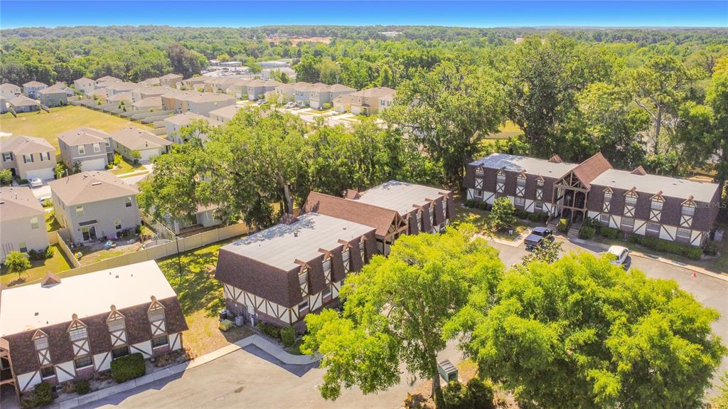 500 Newell Hill Road, Unit 108A Leesburg, FL 34748 - Photo 44 of 44 an aerial view of residential houses with outdoor space and street view