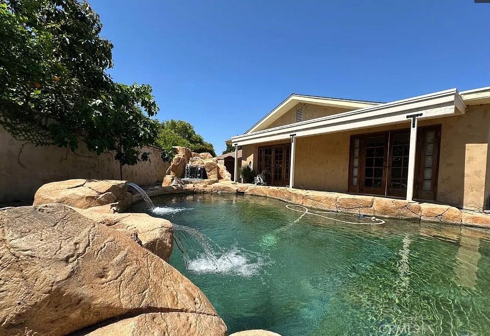 12745 Keith Place Tustin, CA 92780 - Photo 11 of 14 a front view of a house with garden