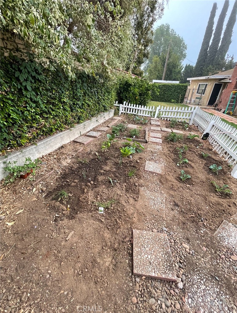 12745 Keith Place Tustin, CA 92780 - Photo 12 of 14 a backyard of a house with lots of green space