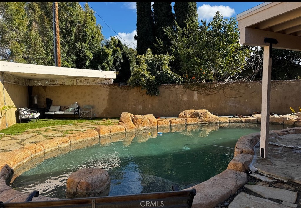 12745 Keith Place Tustin, CA 92780 - Photo 3 of 14 a view of a swimming pool with a yard