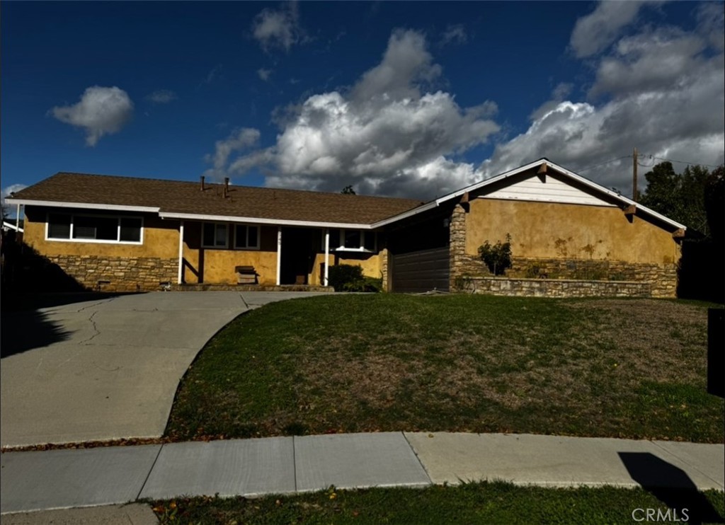 12745 Keith Place Tustin, CA 92780 - Photo 4 of 14 a front view of a house with garden