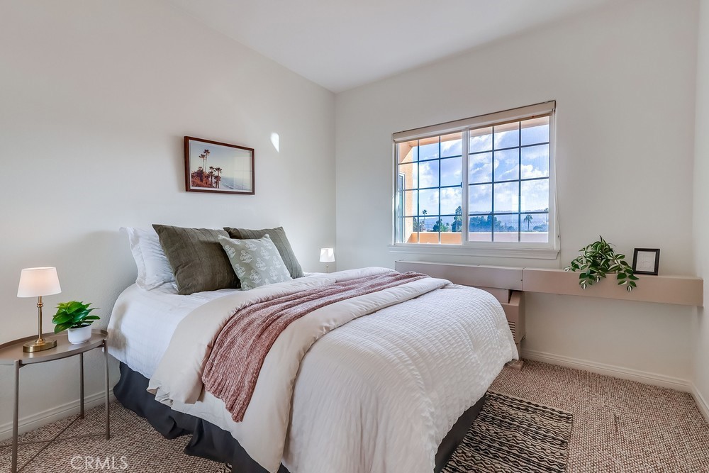 3120 Sepulveda Boulevard, Unit 412 Torrance, CA 90505 - Photo 20 of 40 a bedroom with bed and a window