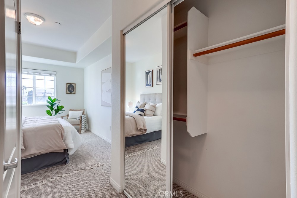 3120 Sepulveda Boulevard, Unit 412 Torrance, CA 90505 - Photo 24 of 40 a living room with furniture and a hallway