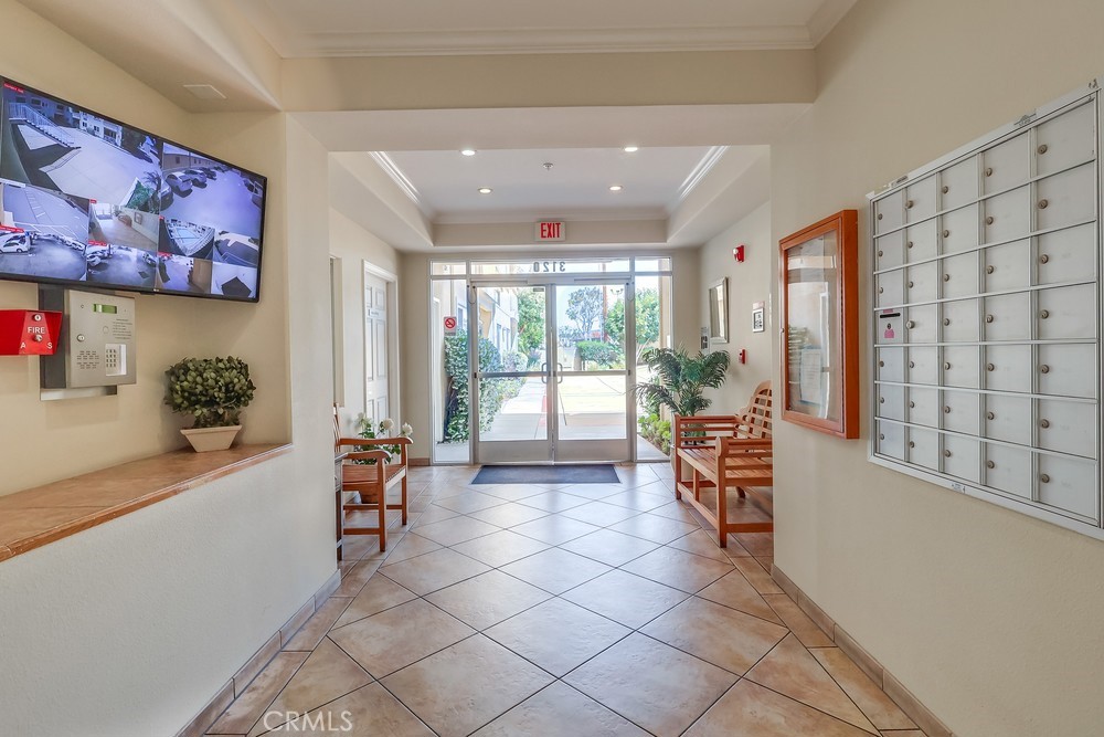 3120 Sepulveda Boulevard, Unit 412 Torrance, CA 90505 - Photo 7 of 40 a living room with furniture and large windows