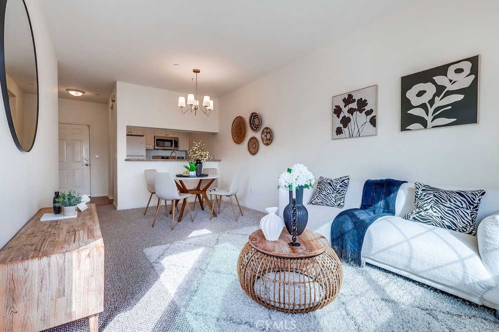 3120 Sepulveda Boulevard, Unit 412 Torrance, CA 90505 - Photo 10 of 40 a living room with furniture and a large window