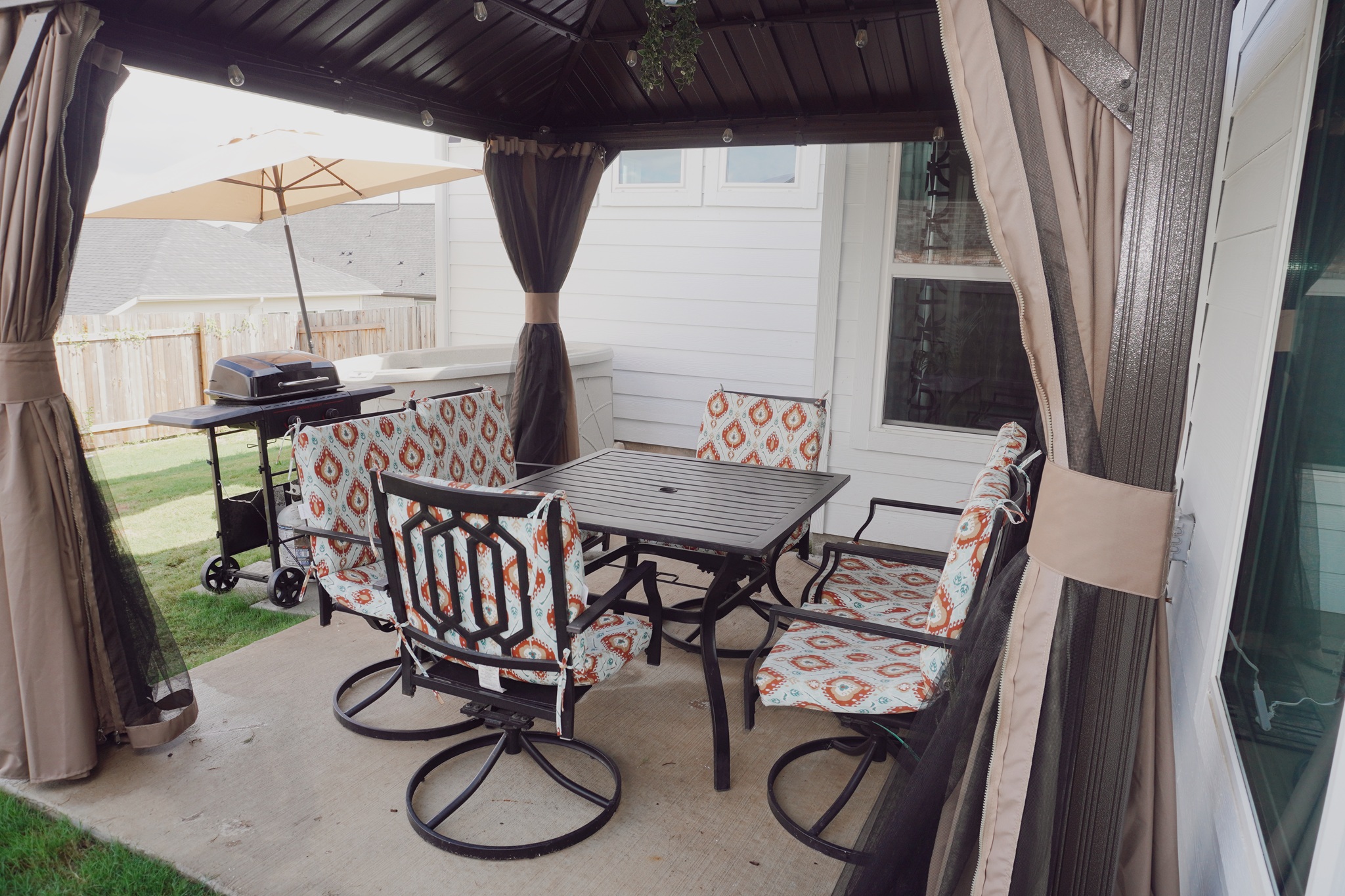 189 Durian Loop Buda, TX 78610 - Photo 34 of 38 View of patio / terrace featuring outdoor dining space, a grill, and a gazebo