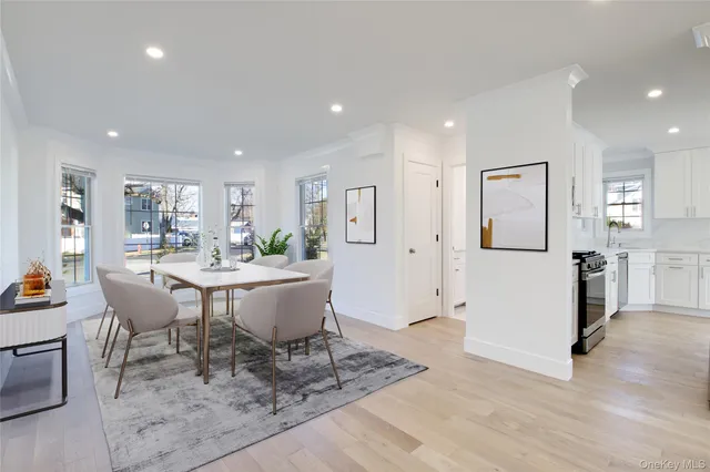 a living room with a table and chairs