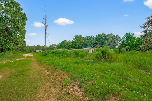 a view of a lake with a big yard