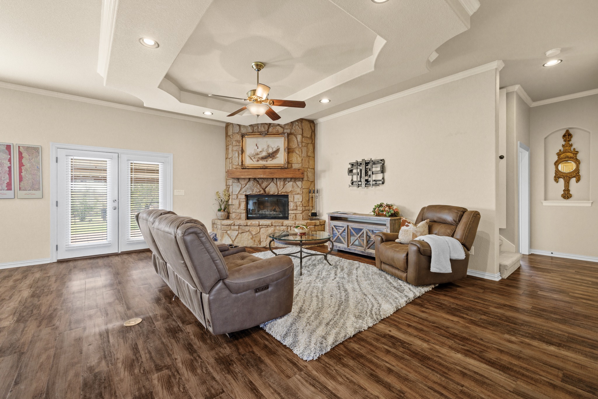 204 Skyline Road Georgetown, TX 78628 - Photo 12 of 40 Living room featuring a fireplace, crown molding, dark wood-style flooring, a ceiling fan, and recessed lighting