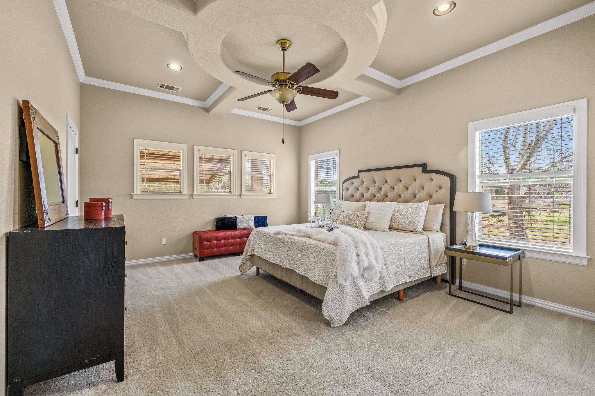 204 Skyline Road Georgetown, TX 78628 - Photo 20 of 40 Bedroom featuring light carpet, a ceiling fan, recessed lighting, coffered ceiling, and crown molding