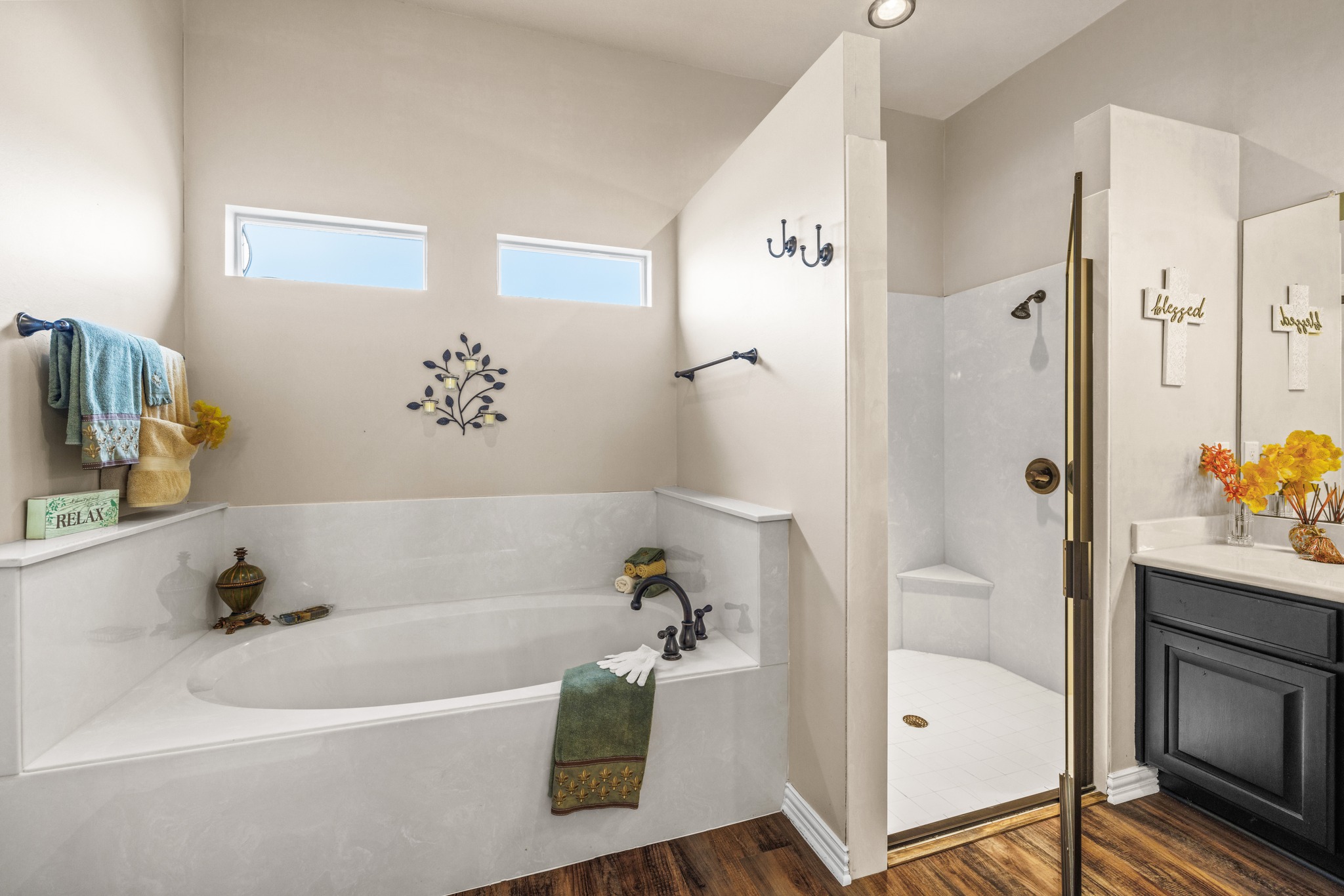 204 Skyline Road Georgetown, TX 78628 - Photo 22 of 40 Full bath with a stall shower, a bath, vanity, and dark wood-style flooring