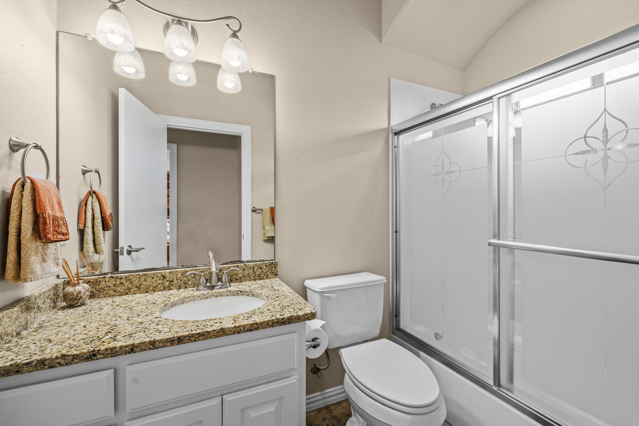 204 Skyline Road Georgetown, TX 78628 - Photo 26 of 40 a bathroom with a granite countertop sink toilet and shower
