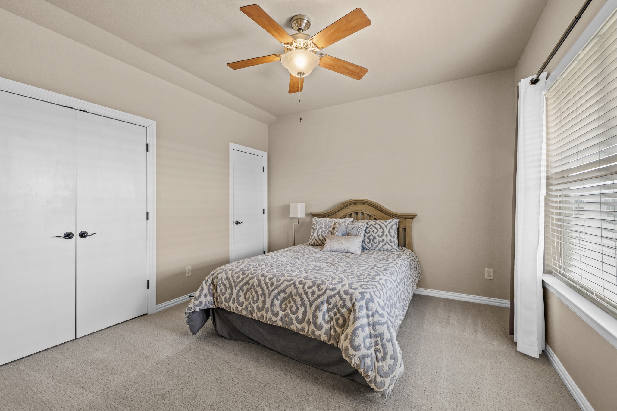 204 Skyline Road Georgetown, TX 78628 - Photo 27 of 40 a bedroom with a bed and a ceiling fan