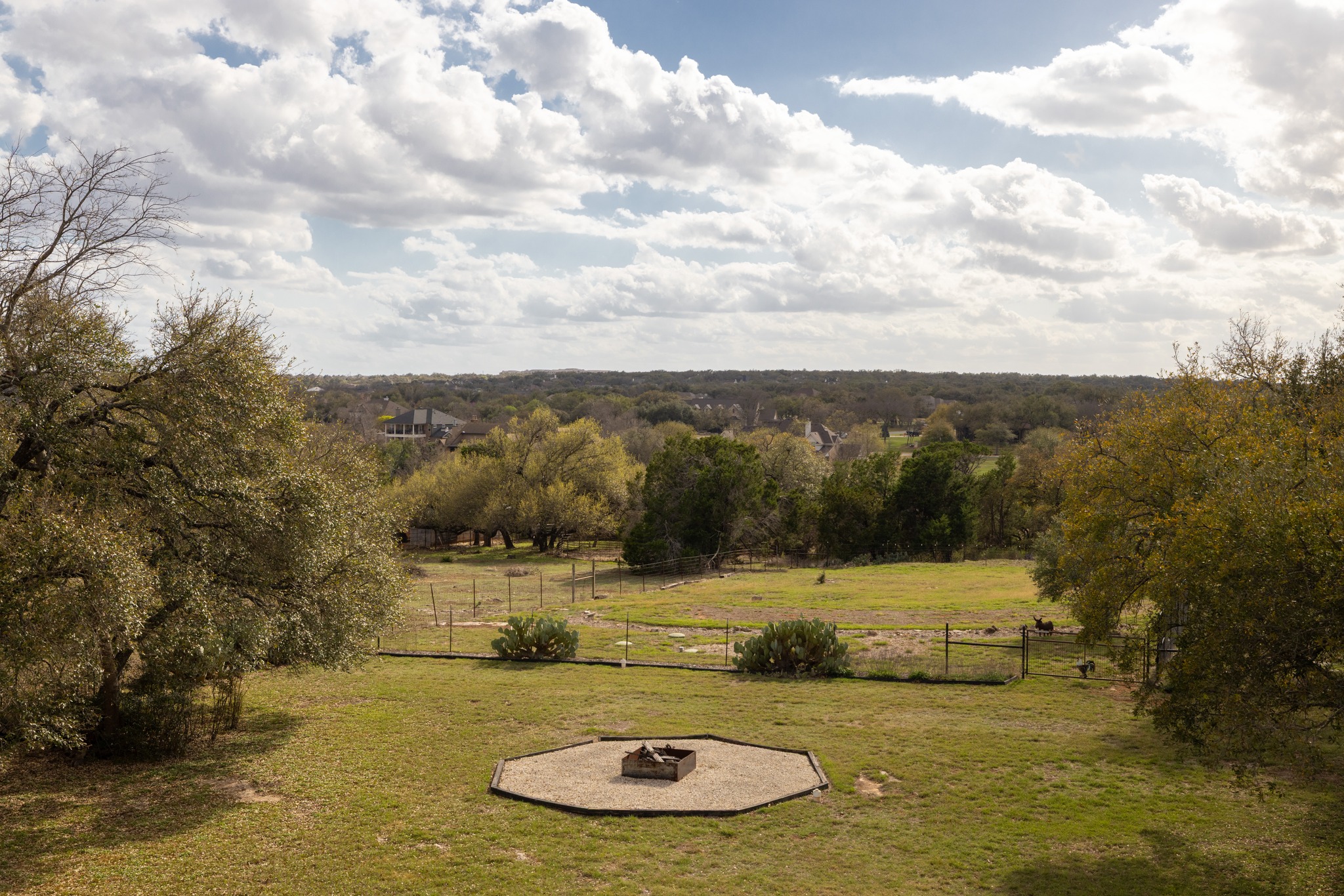 204 Skyline Road Georgetown, TX 78628 - Photo 33 of 40 View of yard featuring an outdoor fire pit and a view of countryside