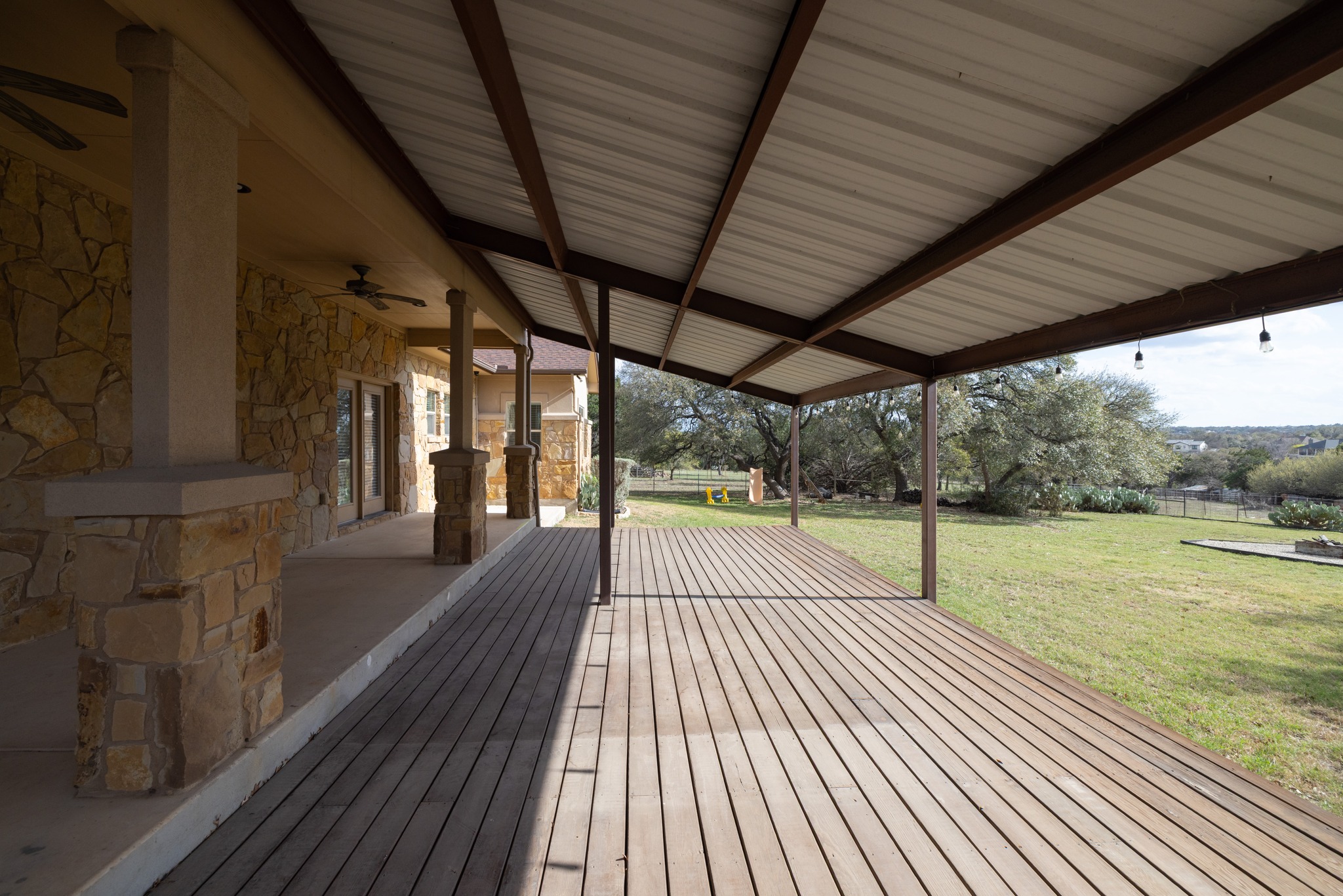 204 Skyline Road Georgetown, TX 78628 - Photo 34 of 40 Deck with a yard, a ceiling fan, and french doors