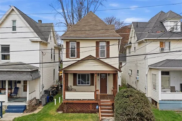a front view of a house with a yard