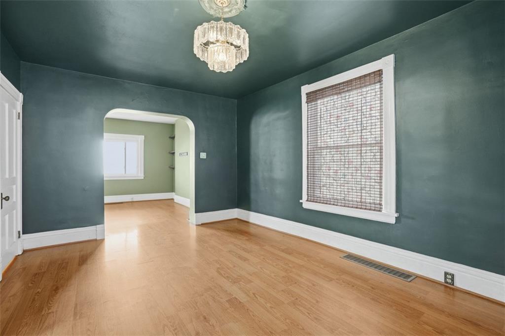 516 Eau Claire Street Butler, PA 16001 - Photo 13 of 41 wooden floor in an empty room with a window
