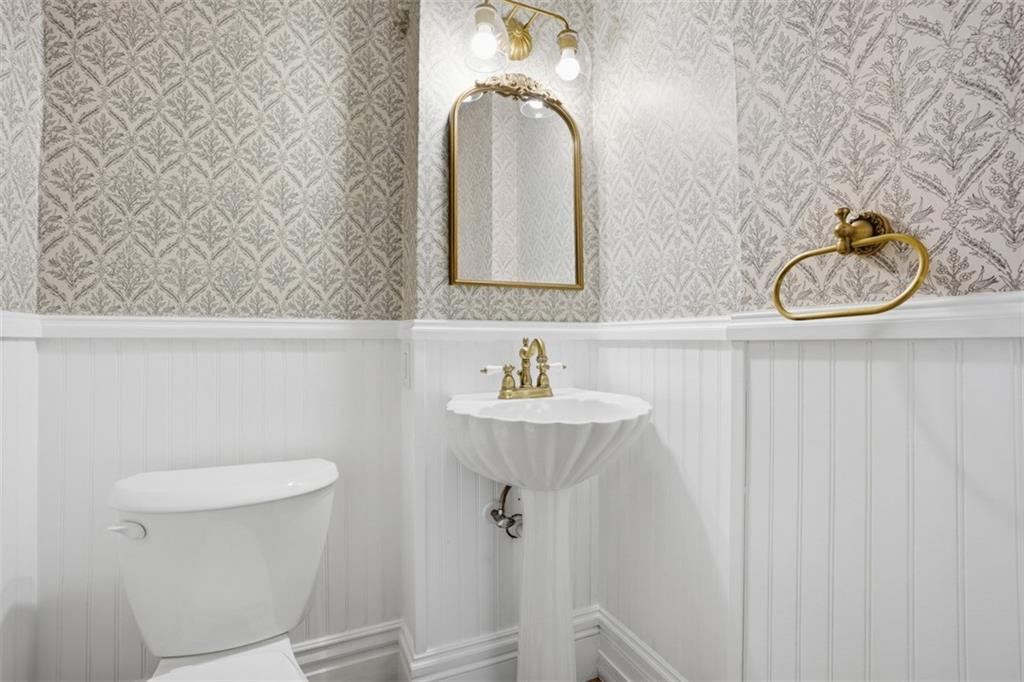 516 Eau Claire Street Butler, PA 16001 - Photo 15 of 41 a bathroom with a sink a toilet and mirror