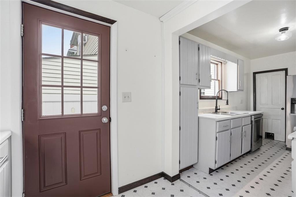 516 Eau Claire Street Butler, PA 16001 - Photo 20 of 41 a bathroom with a sink a mirror and a shower