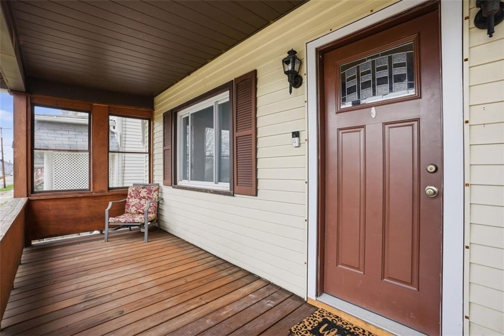 516 Eau Claire Street Butler, PA 16001 - Photo 3 of 41 a balcony with wooden floor and furniture