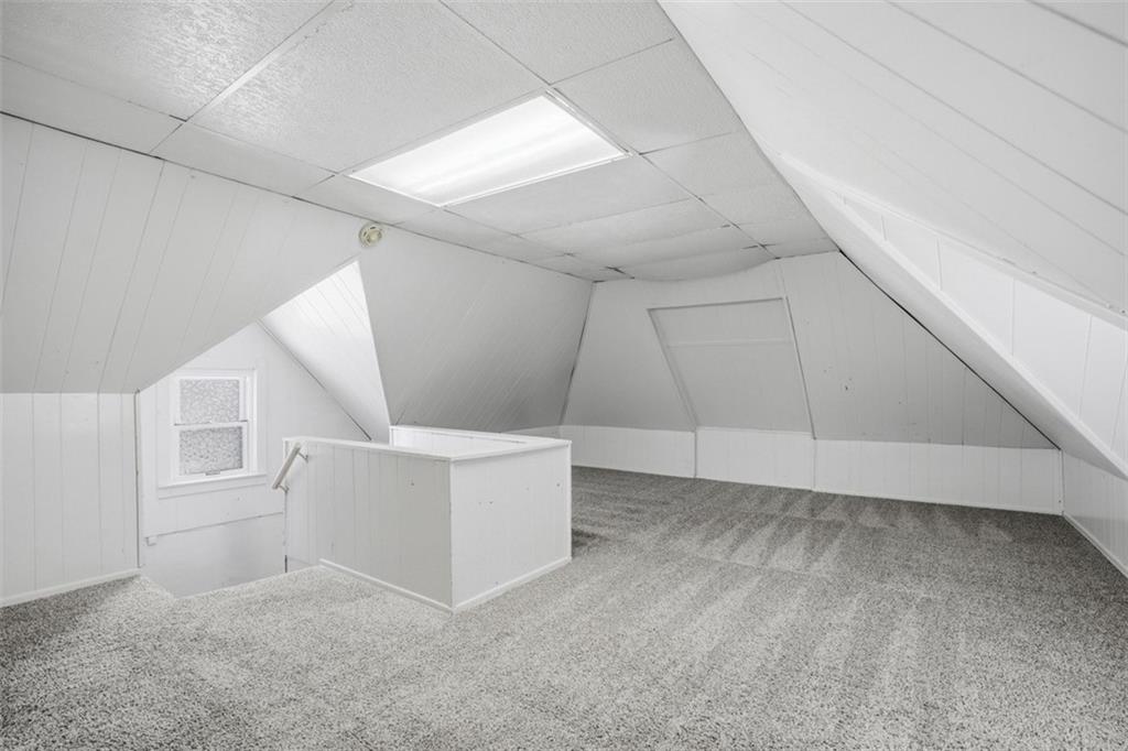 516 Eau Claire Street Butler, PA 16001 - Photo 31 of 41 a view of an empty room with white walls and stairs