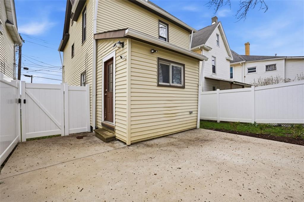 516 Eau Claire Street Butler, PA 16001 - Photo 33 of 41 a view of a white house with a yard