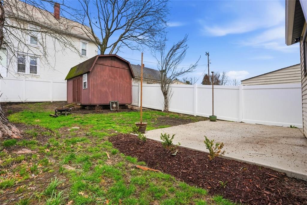 516 Eau Claire Street Butler, PA 16001 - Photo 36 of 41 a front view of a house with a yard and garage