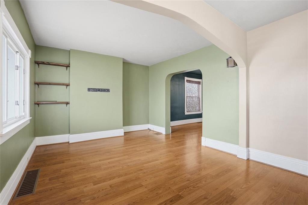 516 Eau Claire Street Butler, PA 16001 - Photo 6 of 41 a view of an empty room with wooden floor and closet