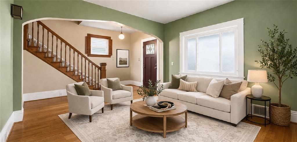 516 Eau Claire Street Butler, PA 16001 - Photo 9 of 41 a living room with furniture and a potted plant