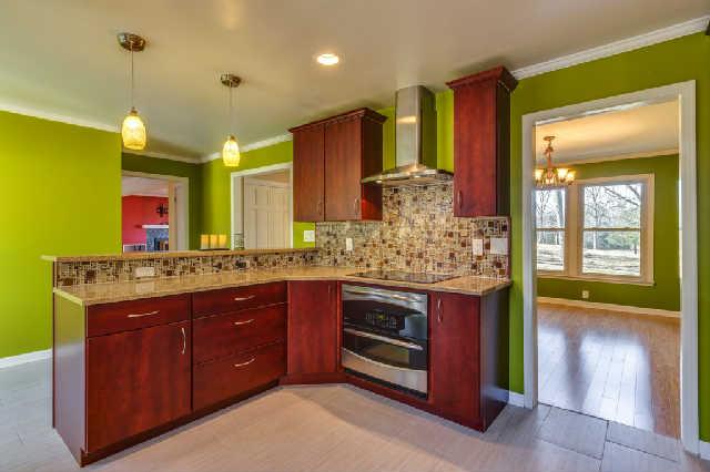 Gourmet kitchen with custom backsplash and state of the art GE Profile appliances!