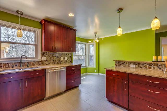 Kitchen has breakfast nook overlooking the private acreage!