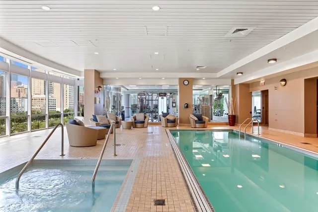 a living room with furniture and a dining table