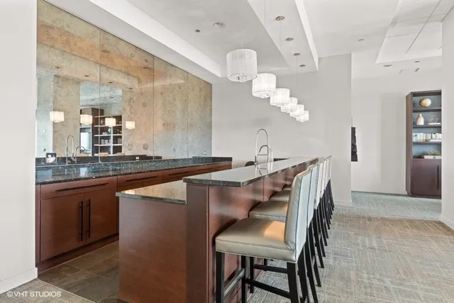a dining hall with a sink and breakfast area